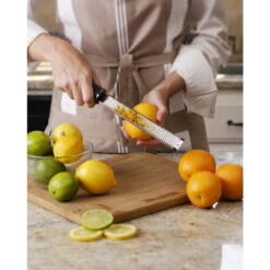 Microplane Premium Classic Zester/Grater -Multifunctional Tool Store MP46020 Microplane Grater Zester Zesting Oranges Back View