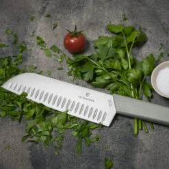 Swiss Modern Colors 7.5" Granton Edge Santoku Knife In Olive Green By Victorinox 12 Swiss Modern Colors 7.5" Granton Edge Santoku Knife In Olive Green By Victorinox -Multifunctional Tool Store VF6905617K6 Swiss Modern Santoku Close up